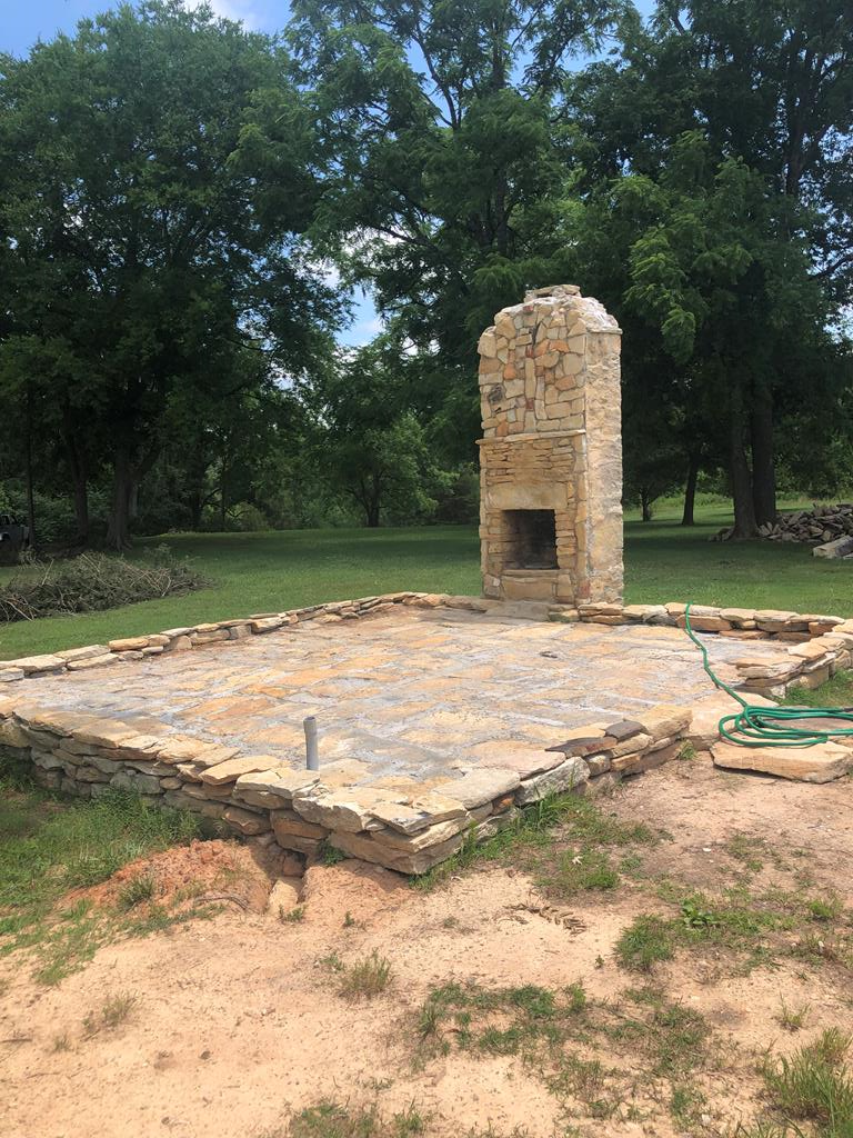 OUTDOOR PATIO WITH WORKING STONE FIREPLACE